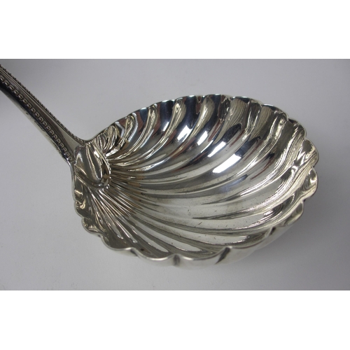 220 - A Georgian silver soup ladle