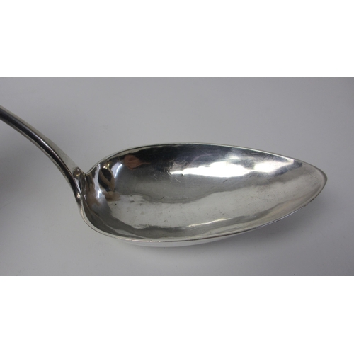 221 - A large white metal serving spoon