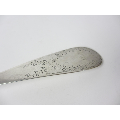 221 - A large white metal serving spoon