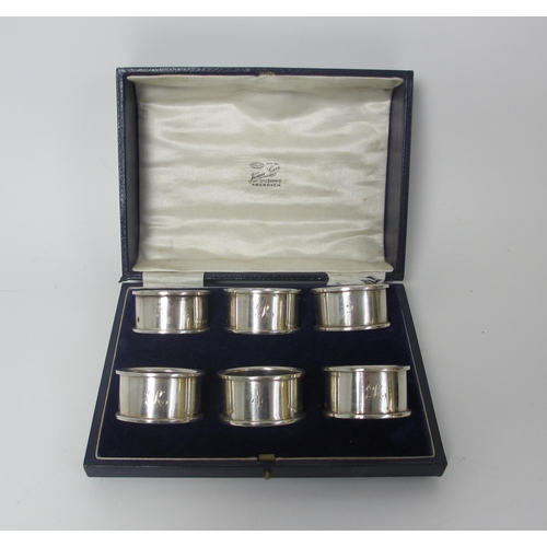 226 - A set of six silver napkins rings