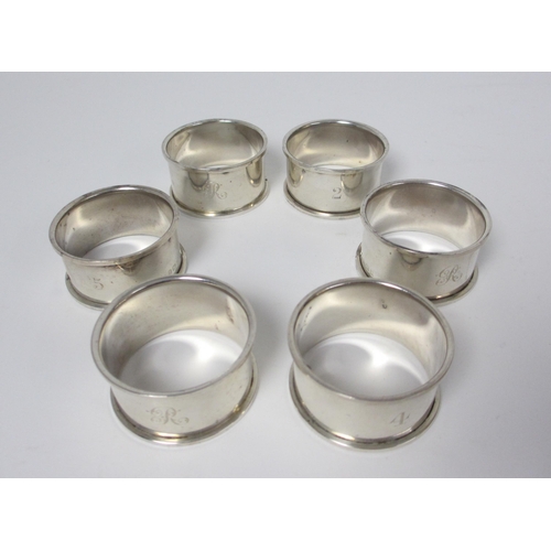 226 - A set of six silver napkins rings