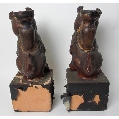 600 - A pair of painted terracotta joss stick holders