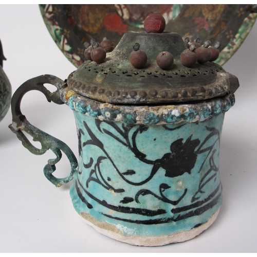 601 - An Indian polychrome jug with metal mounts