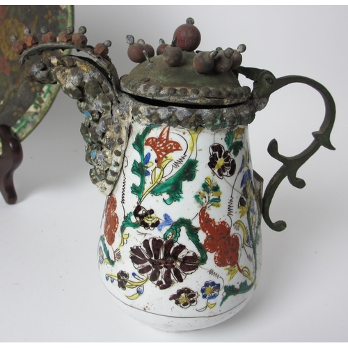 601 - An Indian polychrome jug with metal mounts