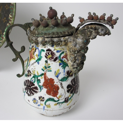 601 - An Indian polychrome jug with metal mounts