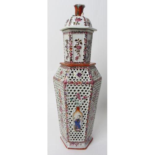 605 - A Chinese famille rose hexagonal reticulated and encased vase and cover