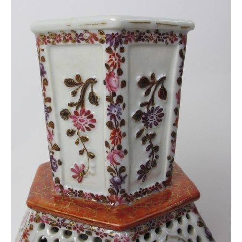 605 - A Chinese famille rose hexagonal reticulated and encased vase and cover