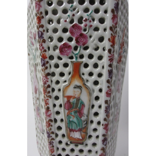 605 - A Chinese famille rose hexagonal reticulated and encased vase and cover