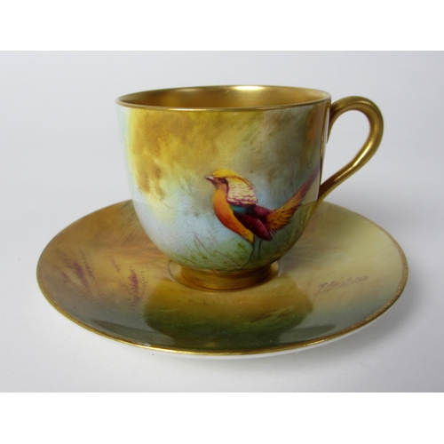 651 - A Royal Worcester cabinet cup and saucer