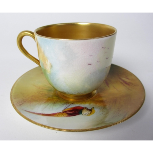 651 - A Royal Worcester cabinet cup and saucer