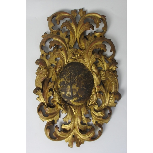 653 - A pair of 18th Century gilt pine pierced foliate cartouches