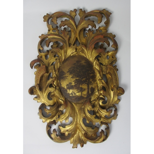 653 - A pair of 18th Century gilt pine pierced foliate cartouches