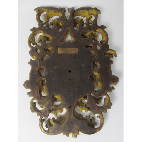 653 - A pair of 18th Century gilt pine pierced foliate cartouches