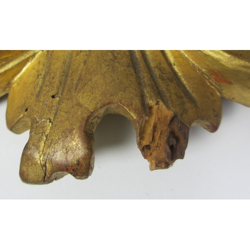 653 - A pair of 18th Century gilt pine pierced foliate cartouches