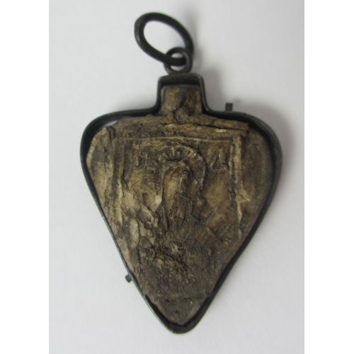 656 - A Pilgrim's ivory heart shaped token in metal mount