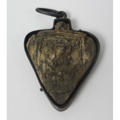 656 - A Pilgrim's ivory heart shaped token in metal mount