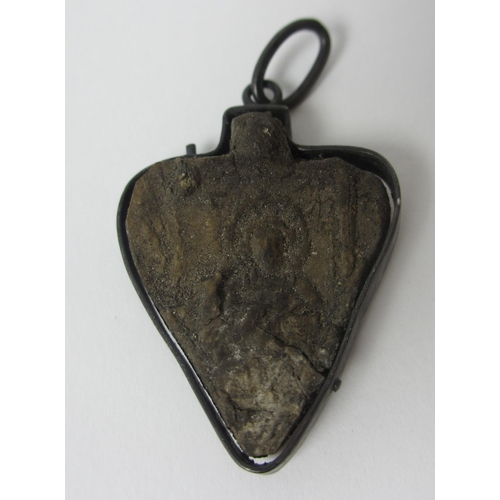 656 - A Pilgrim's ivory heart shaped token in metal mount