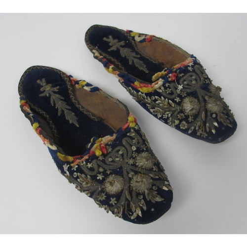 657 - A pair of leather and straw woven moccasins