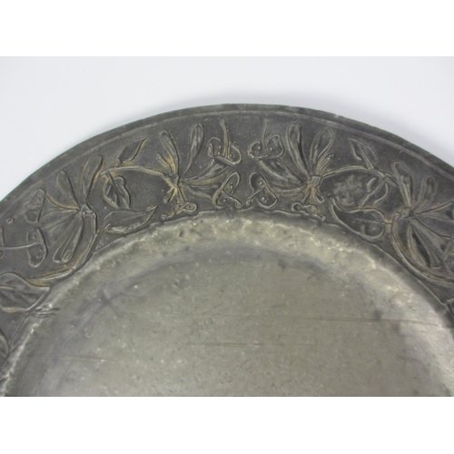 659 - An Arts and Crafts pewter dish