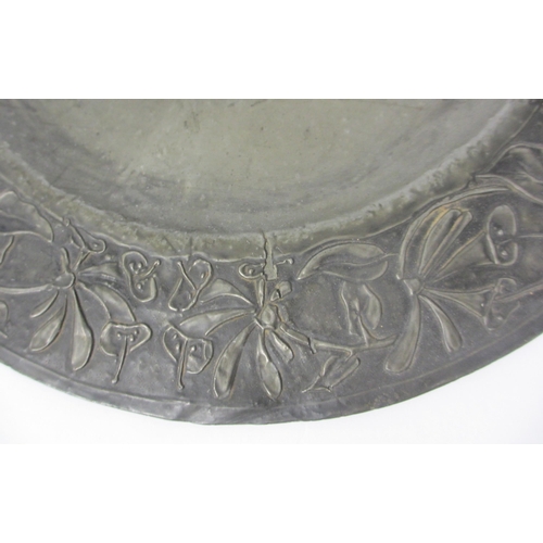 659 - An Arts and Crafts pewter dish