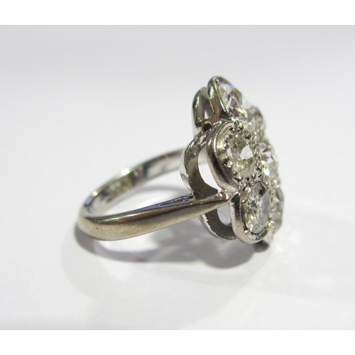 66 - A large daisy head diamond cluster ring