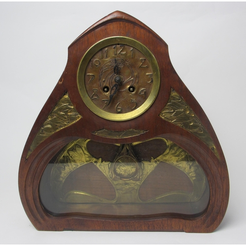 660 - A Continental Art Nouveau mahogany and gilt metal mantle clock