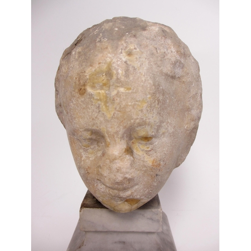 675 - A Roman marble head of a young boy