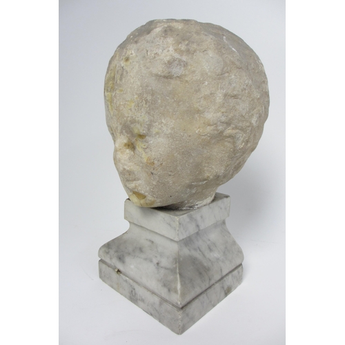 675 - A Roman marble head of a young boy