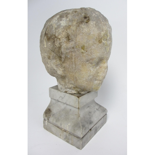 675 - A Roman marble head of a young boy