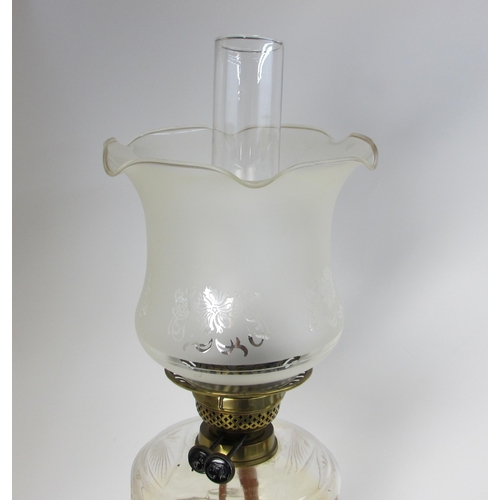 693 - A Victorian cut glass oil lamp