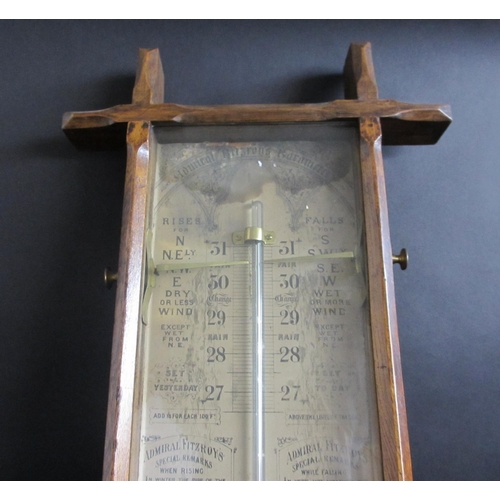 694 - An Admiral Fitzroy oak cased barometer and thermometer