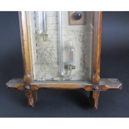 694 - An Admiral Fitzroy oak cased barometer and thermometer