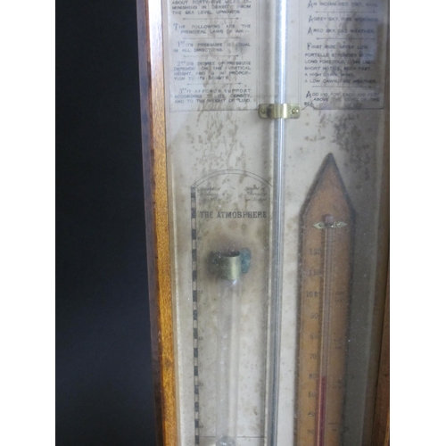 694 - An Admiral Fitzroy oak cased barometer and thermometer