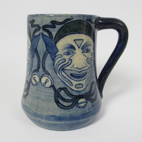 698 - A handpainted mug attributed to Della Robbia