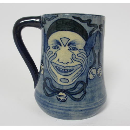 698 - A handpainted mug attributed to Della Robbia