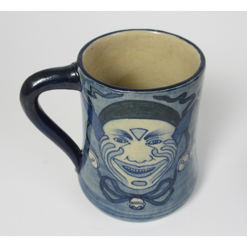 698 - A handpainted mug attributed to Della Robbia