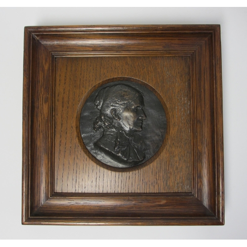 701 - A pair of bronze portrait roundels of a lady and gentleman in profile