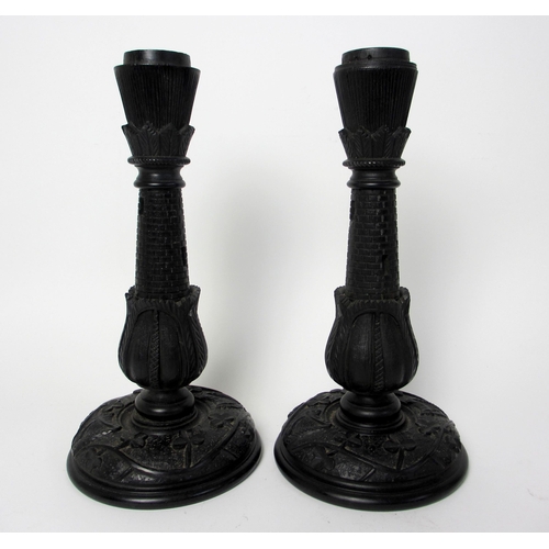 704 - A pair of Irish bog oak candlesticks