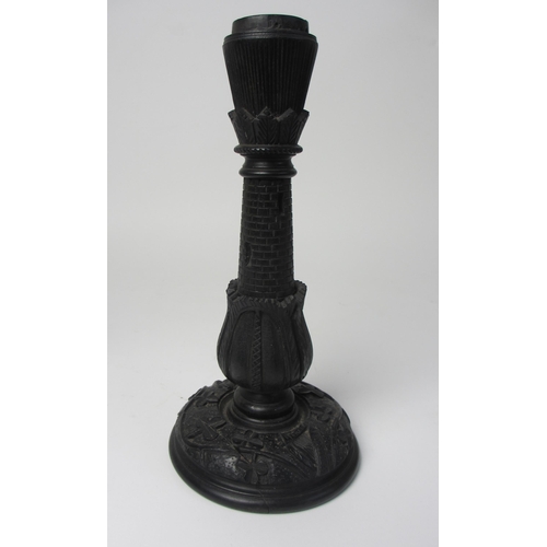 704 - A pair of Irish bog oak candlesticks