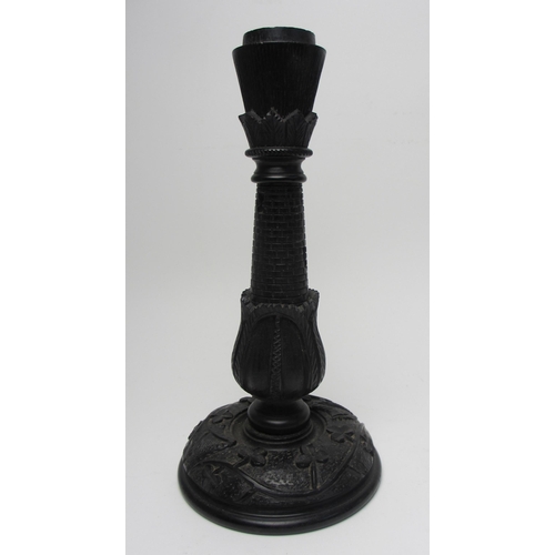 704 - A pair of Irish bog oak candlesticks