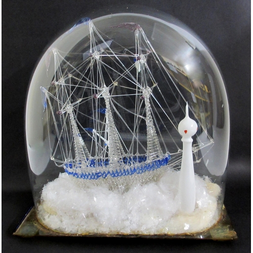 708 - A Victorian spun glass ship and pilot passing a lighthouse