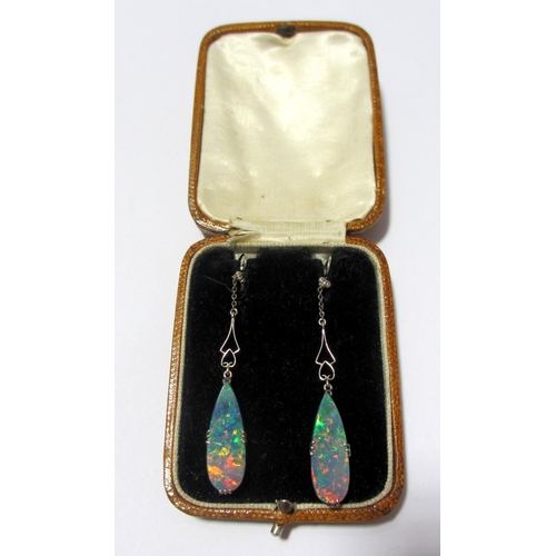 72 - An attractive pair of Art Deco style oval pendant earrings