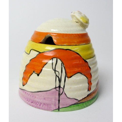 724 - A Clarice Cliff 'Mountain' design honey pot