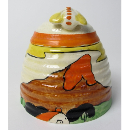 724 - A Clarice Cliff 'Mountain' design honey pot