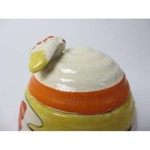 724 - A Clarice Cliff 'Mountain' design honey pot