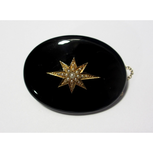 76 - A Victorian gold  black onyx and pearl brooch