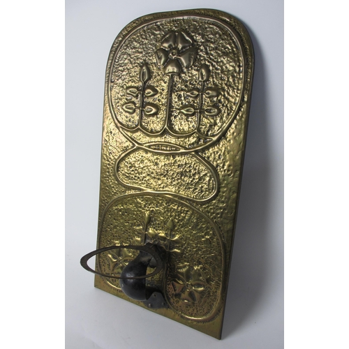 765 - A Glasgow style brass and iron sconce