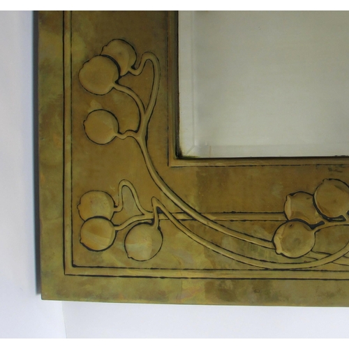 770 - A Glasgow Style embossed brass rectangular wall mirror