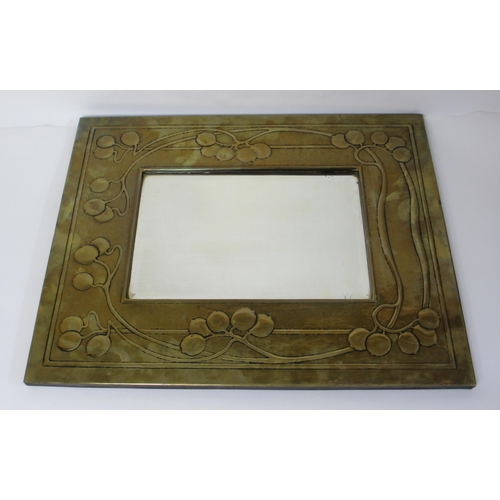 770 - A Glasgow Style embossed brass rectangular wall mirror