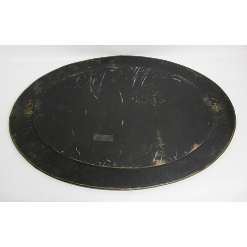 772 - A Glasgow style embossed brass oval wall mirror